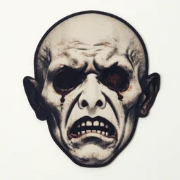 textile cutout of a creepy face