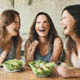 women laughing at salad