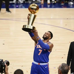julius randle lifting the nba trophy for the knicks, confetti dropping, getty images, full resolution