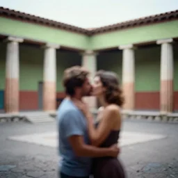 out of focus, blurry photography by saul leiter and ernst haas in a pompeii court, airforce blue, red, bright pale green, no people, just one man and one woman kissing