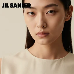 close up of face of female fashion model in minimalistic dress, beige colors, official jil sander editorial