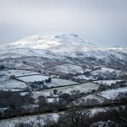 a photo of yeovil, snowy mountain backdrop, atmospheric, beautiful, natural