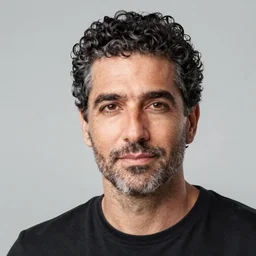 European man photograph, black and grey shorter curly hair, 38 years old, good looking , intelligent