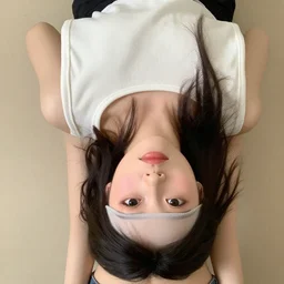 girl dressed in underboob top, camera looks up