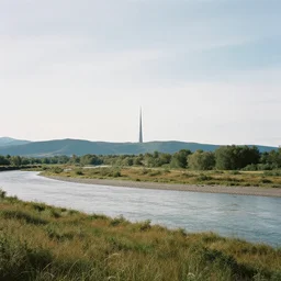 a landscape with a river in the middle and a lone, tall and thin spire mountain off in the distance, by terese nielsen