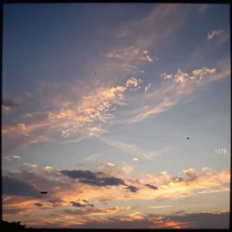 video of the sky, recorded with vhs, sunset, clouds, 1 9 7 9, vhs artifacts, details, static