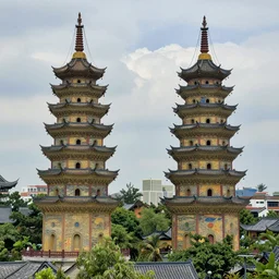 twin ornate chinese buddhist pagodas in a beautiful chinese landscape by vincent van gogh