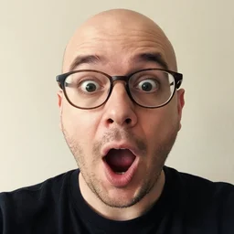 3 0 - year old bald man with glasses and sparse beard, selfie opening mouth, surprise, eyes wide open, 2 0 1 5