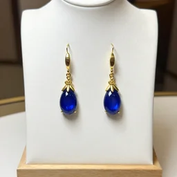 jewelry design, jewelry display, a pair of earrings for snow white