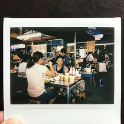 polaroid photo of a singaporean hawker