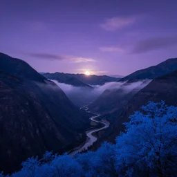 Panoramic photo where the mountains are towering over the valley below their peaks shrouded in mist. The moon is just peeking over the horizon and the purple sky is covered with stars and clouds. The river is winding its way through the valley. The tree are a bright blue.