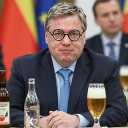 photo of viktor orban wearing round glasses with craft beer by terry richardson