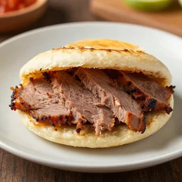 dslr food photograph an arepa filled with sliced meat 8 5 mm f 1. 8