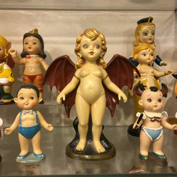 vintage collection of 1 9 6 0 s succubus sculpture toys on display