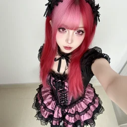 jeffree star 2 0 0 0 s selfie with pink red hair wearing a romantic goth skirt