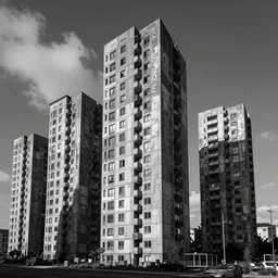 a tumble of brutalist apartments in black and white made of asemic writing