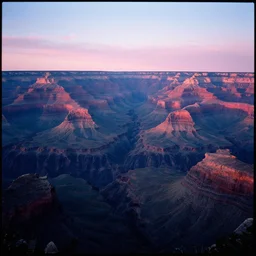 kodak portra 4 0 0 photo of the grand canyon, pink and blue sunset, wide angle, 3 5 mm, sharp focus, soft light, volumetric light, in the style of gregory crewdson, masterpiece