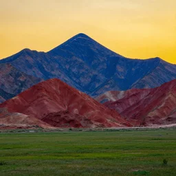 highly detailed photo of blue and red colored big mountains and green open field, yellow colored sunset, hyper realistic, art by greg rutsowski, concept art, 8 k detail post - processing