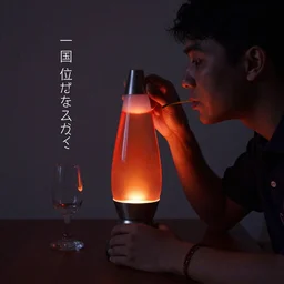 a guy drinking a lava lamp