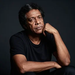 portrait of chico buarque, relaxed look, dark background, studio light, hdr, nikon 2 4 mm f / 1. 8 g, by sebastiao salgado