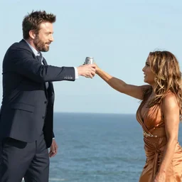 photo of ben affleck hitting jennifer lopez with a beer can in his other hand