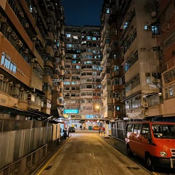 photo inside kowloon walled city at night