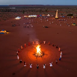 stunning aerial drone photograph of festival dancers on the edge of the red australian desert at night, bonfire, accurate bodies, campsites, diverse costumes, 8 k, ultra clear detailed