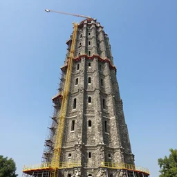 giants constructing a really high tower made of stone