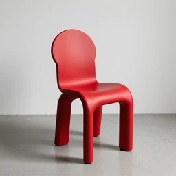a beautiful red chair designed by marc newson