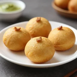 a photo of a plate containing medhu vada, highly detailed, trending on artstation, bokeh, 9 0 mm, f / 1. 4