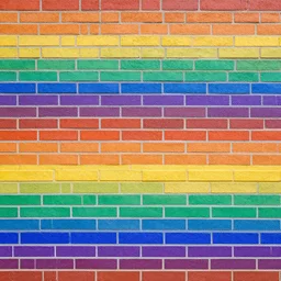 a brick wall with rainbow coloured bricks