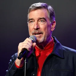 color still shot of mister fred rogers lead singer performing in music group insane clown posse, face closeup