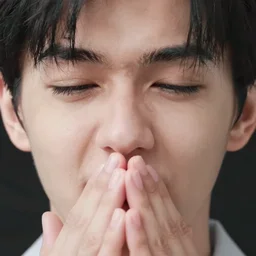 high quality Foto of a human face around 20 years old, closeup, mid sneeze