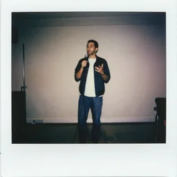 albanian stand up comedian performing, 9 0 s polaroid, colored, long exposure, natural lighting, by jamel shabbaz, robert mapplethorpe, davide sorrenti