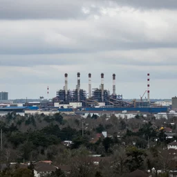 a big industrial city metropoli in the distance, cloudy sky
