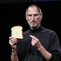 steve jobs presenting a slice of bread at the macworld confrence in 2007, press photos