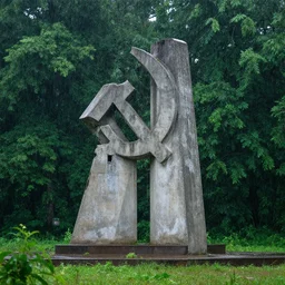 Photo of an abandoned concrete soviet monument in a rainforest while raining, Sigma 100mm, long shot