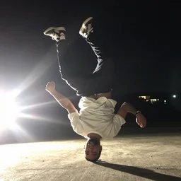 2 0 0 3 cursed image of drake breakdancing outside at night, iphone 4 camera, terrible lighting, flare,