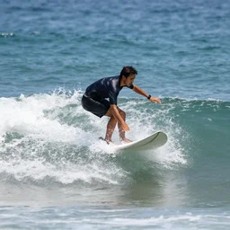 guy riding a wave.
