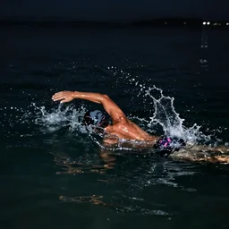 someone swimming in dark waters at night, dark atmosphere. dynamic composition, concept art. sharp focus, splash. by piotr jablonski and phil hale