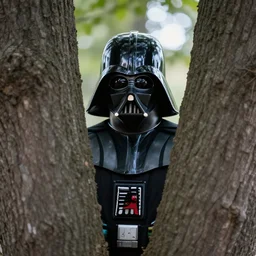 high quality photo of darth vader hiding behind a tree, photography 4k, f1.8 anamorphic, bokeh, 4k, Canon, Nikon