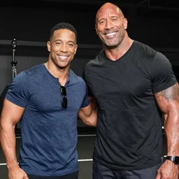A tall Kevin Hart beside a Short Dwayne Johnson