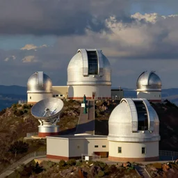 Modern Spanish observatory of multiple telescopes scattered across the mountaintop  painted in colourist style by Turner