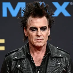 promotional image of hugh laurie as a british punk rocker in a new movie, leather clothes, heavy makeup, detailed face, movie still frame, promotional image, imax 70 mm footage