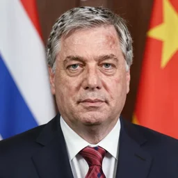 viktor orban with highly detailed face wearing many neckties