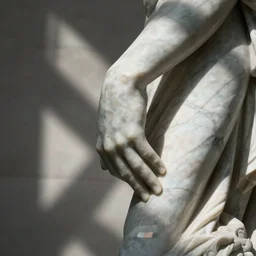 a marble statue dabbing