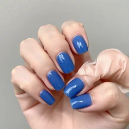 a hand with blue nails
