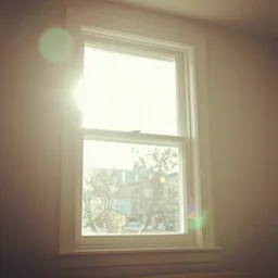 photo of interior design house, super detail of a white window in a living room, close up, view from bottom, sunday morning, sun, bokeh, lens flare hit camera, yellow light, diffuse light, instagram trending picture, instagram filter, smoky, foggy, vintage photography, grainy, light leaks