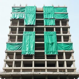 long shot, canon 1 dx, 1 4 mm wide lens, f 2 2, front angle facade architectural photography of a rcc building under construction in india with cobalt green plastic torn sheets hanging from few floors ; exterior view, natural day lighting, highly detailed