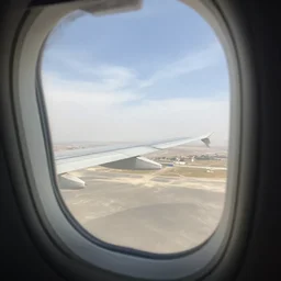 view into a car window from an airplane, extreme perspective, forshortening, special effects ultra zoom
